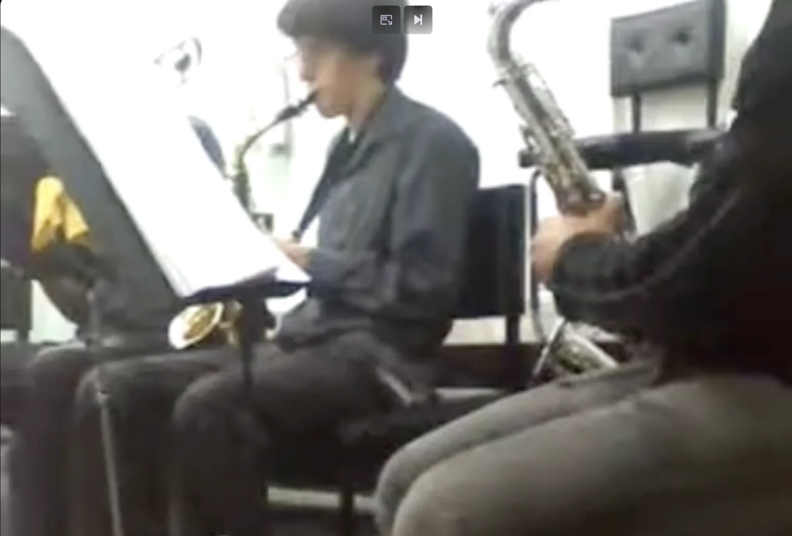 Renilson playing alto sax in a church orchestra in 2010